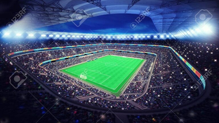 partido de futbol en estadio iluminado